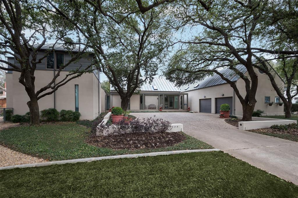 Welcome to 4305 Glenleigh Dr., a stunning architectural masterpiece designed by Max Levy in 1986. This exquisite residence offers 4,398 square feet perfectly situated at the end of a cul-de-sac on a nearly half-acre lot. The home's elegant stucco exterior and metal roof create a timeless and sophisticated appearance. Step inside to discover a harmonious blend of style and comfort, highlighted by recently replaced abundant windows bathing the home in natural light. The first level features beautiful wood flooring, complemented by plush carpeting in the primary bedroom. The kitchen is a chef's dream, boasting built-in cabinets, double ovens, 6-burner gas cooktop, refrigerator, and wine refrigerator. Kitchen seamlessly opens to a bright breakfast area and welcoming family room, complete with fireplace and generous sitting area. Home offers four bedrooms and five and a half bathrooms; two bedrooms conveniently located on the first level, including an expansive primary suite. Primary bedroom is a luxurious retreat, featuring a deluxe bathroom, extensive walk-in closet, and office alcove. Formal living room, adorned with cozy gas fireplace, showcases charming reading alcoves with window seating, providing picturesque views of front and back yard areas. Thoughtfully designed second level houses fourth bedroom, on a private wing at the opposite end of the house from the quarters, ensuring comfort and privacy for guests or family members. Outdoor living is simply divine with fenced play yard and sparkling pool in the backyard; perfect for entertaining or peaceful relaxation. The screened porches, featuring Epay wood flooring, offer serene outdoor spaces to unwind and take in the surrounding beauty. Additional highlights include a convenient motor court in front, an attached two-car garage, and a thoughtfully landscaped yard, offering both beauty and practicality. This home is not just a residence, but a sanctuary designed for gracious living and timeless elegance.