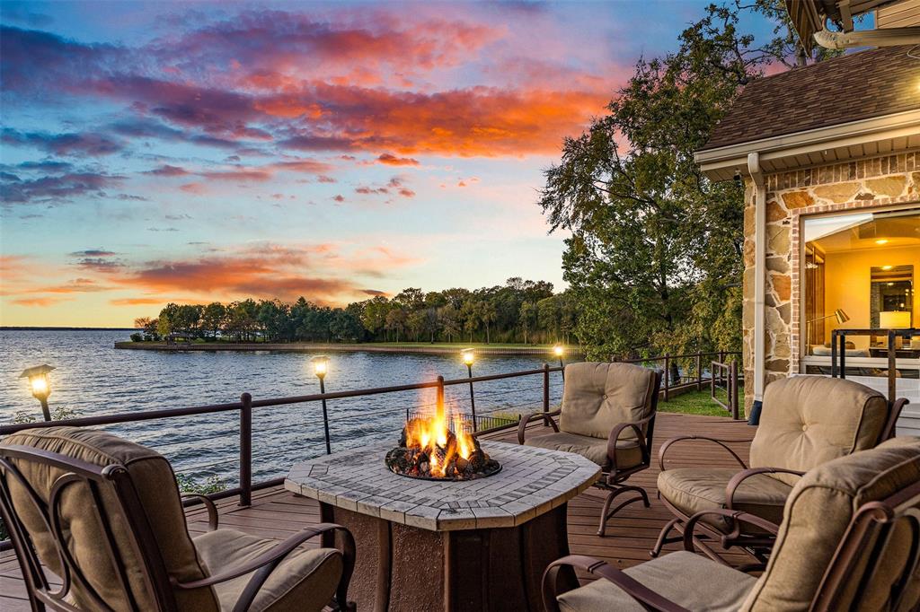 **Luxurious Lakefront Living at Pinnacle Golf Club**  
Welcome to your dream home at Pinnacle Golf Club, the premier golf club community on the shores of Cedar Creek Lake-- this breathtaking 4-bedroom, 3.1-bathroom retreat impeccably blends modern design with unparalleled comfort. Constructed with a durable steel frame, this home is a testament to quality and endurance. The heart of the home features an inviting open living concept where the living room, kitchen, and dining space seamlessly unite, all framed by the serene backdrop of the lake. The primary bedroom, adjoining this main gathering area, offers a tranquil sanctuary overlooking the water. The three car garage offers a unique elevator that provides access to tons of attic storage, with possibilities to be finished for additional space. A see-through fireplace connects the main living area to a second living space configured as a game room complete with a full bar. Three additional bedrooms, including darling custom modern bunk room, branch off from the game room. The screen porch extends the home's living space outdoors and the patio has a retractable awning and cozy outdoor fire pit overlooking the cove, ideal for swimming. Boating enthusiasts will revel in the newly constructed boathouse, completed in early 2024, perfectly positioned for easy and direct access to the water, which is as pretty as it is functional with wood ceiling, recessed lighting and full spider control system, metal roof, and two PWC lifts. Come see for yourself and make this extraordinary property your forever home. 
Ask agent for more info!

One year social membership to Pinnacle Club included with purchase.  Buyer responsible for HOA fee of .002% of sales price at closing.  Club offers restaurant and clubhouse, access to our 24 hour fitness center, enjoyment of the junior olympic size swimming pool, use of the tennis courts, and attendance to a wide variety of special member events.