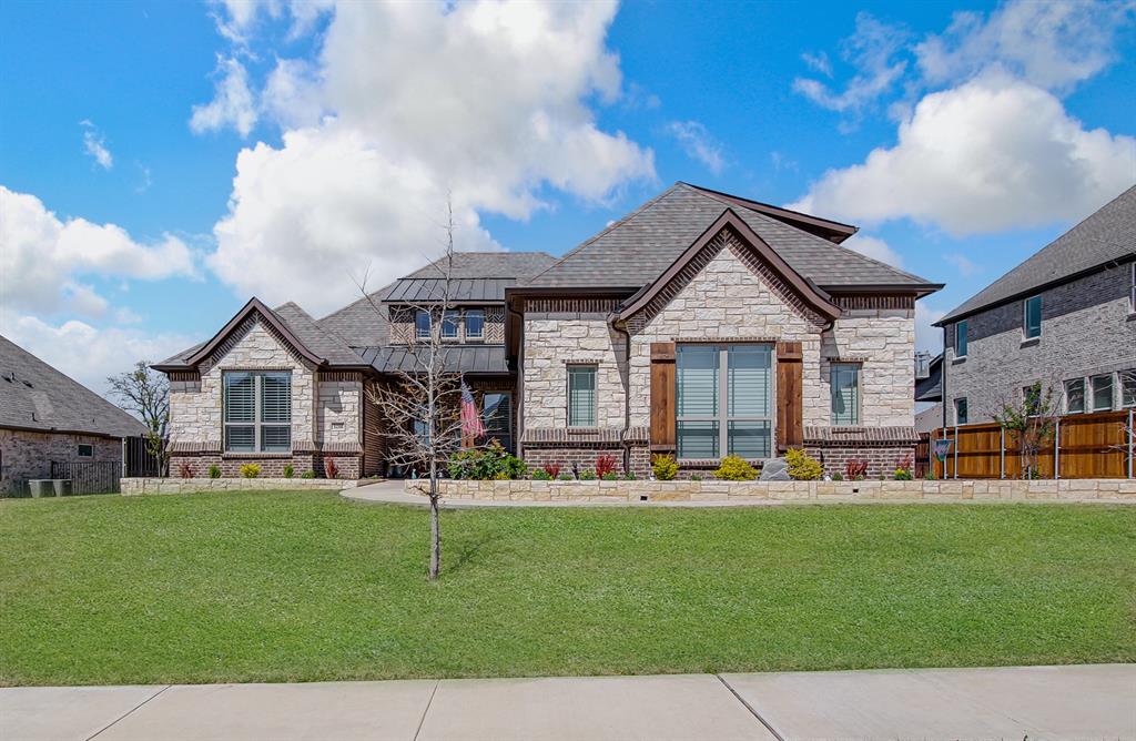 Immaculate, move-in ready, custom home in Mansfield offering a clean, modern aesthetic, functional layout, & outdoor space designed for comfortable, year-round living. Features 5 bedrooms & a study. The open-concept floor plan creates a natural flow between the main living area, dining space, & kitchen, with abundant natural light. The kitchen is thoughtfully designed with gorgeous cabinetry, a large island, granite counters, 5 burner gas cooktop and double ovens. A second story features a large bonus room and half bathroom.  Large primary suite with resort style bath has a separate shower, a soaking tub and a large walk in closet. The private back yard includes a large covered patio which creates an additional outdoor living space with a  fireplace & electric shades that fully screen the area - creating a usable outdoor living environment in every season. Oversized 3 car garage, plantation shutters in the bedrooms, and the laundry room includes a sink and mud locker bench. Just minutes from dining, shopping and entertainment!