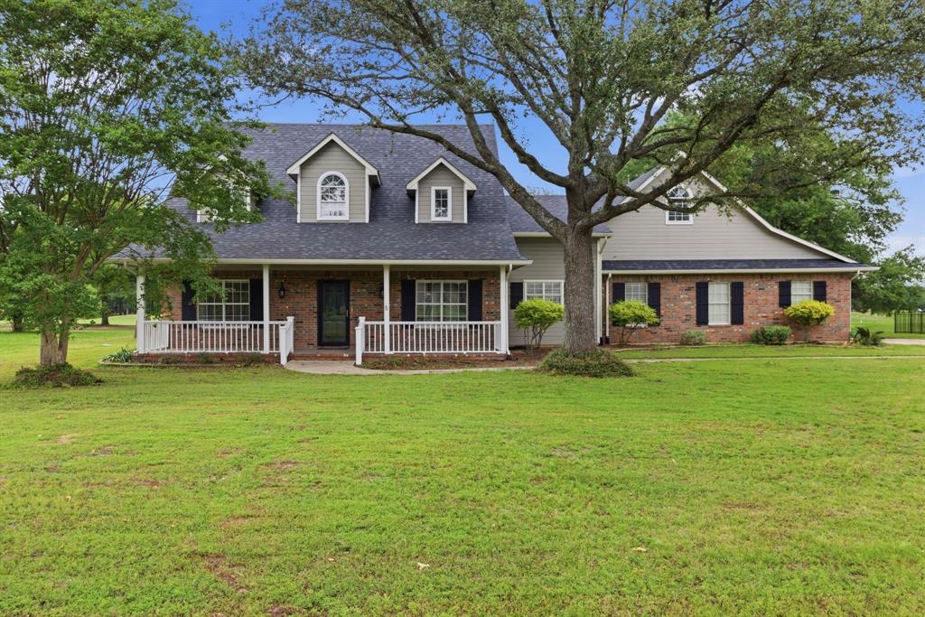 Nestled along the 8th hole of Lake Fork Golf Course, this beautifully single story home is located in one of the area’s most sought-after subdivisions—complete with a private community boat ramp to world-famous Lake Fork.
Offering over 2,600 square feet, this home features a spacious open-concept layout with a large kitchen, vaulted ceilings, and a stunning brick fireplace that anchors the main living area. The split-bedroom floor plan provides privacy, while abundant windows showcase picturesque golf course and countryside views, along with mature trees that offer relaxing afternoon shade.
Enjoy outdoor living at its best with a generous 10x23 front porch and an expansive 8x35 covered back patio—perfect for entertaining friends after a day on the water or the course. Additional features include a 10x18 workshop or golf cart storage space.
The oversized primary suite includes a private en-suite bath and a large walk-in closet, creating a comfortable retreat at the end of the day.
Opportunities like this don’t come around often—golf course homes in this community are truly rare. Schedule your showing today and bring your best offer! Buyer to verify all information.