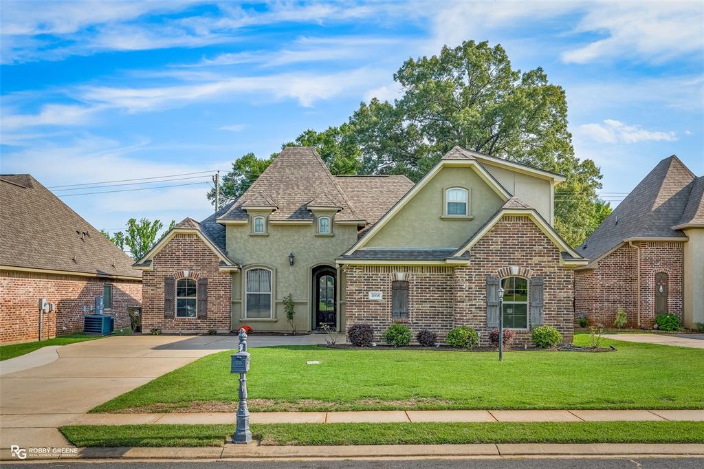 This beautiful home with 5 bedrooms is nestled on a quiet dead-end street in the highly sought-after Dogwood South community. Located in the newer section and zoned for Haughton schools, it offers both comfort and convenience. From the moment you step inside, you’ll appreciate the open-concept layout and stunning wood flooring that flows seamlessly from the entryway into the spacious living room. The living room is complete with a gas fireplace and large windows. The dining area is generously sized and features a raised bar off the kitchen island—perfect for entertaining and staying connected with family and guests while cooking. The kitchen features all stainless steel appliances, plenty of cabinet space, and granite countertops. The remote master features an ensuite bathroom with a jetted tub, walk in shower, and a large walk in closet. Three additional bedrooms and full bathroom are also found on the opposite side of the home. Upstairs, a large bonus room with a full bathroom and closet provides the ideal space for private space, guest quarters, or a game room. This home also features a roof that is only 3 years old! Enjoy the backyard that features a covered patio, shed, and no rear neighbors. Schedule your showing today!!