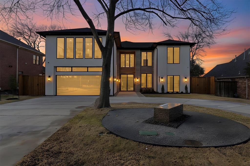 Driving up to this magnificent, newly completed home, you’re immediately embraced by a sense of awe!  The gentle murmur from the water feature, and the expansive circular drive are just the beginning of what’s to come!  A subtle, soft color palette flows throughout the living areas, creating a warm airy atmosphere. Natural Taj Mahal stone surfaces add gentle movement and organic texture, their creamy tones together with rich white oak cabinetry bring a warm, quiet luxury. A light-colored plaster fireplace in the living room serves as a serene focal point, its smooth texture and sculptural presence grounding the space, radiating comfort while maintaining a modern, minimalist elegance. Beautiful yet practical, and perfect for family living or entertaining, the kitchen and butler pantry are appointed with every possible thing to make cooking and entertaining a breeze. All Thermidor appliances, 2 refrigerators, the main one disappears into the cabinetry, 2 dishwashers, 2 microwaves, 2 farm sinks, commercial grade gas range and additional oven, not to mention the enormous pantry & pot filler!  Spectacular dining room anchored by a full wall wine storage cabinet with glass doors. 6 large bedrooms with ensuite baths, can accommodate any size family; the 2nd bedroom on the first level would be an ideal mother-in-law suite. Dedicated office with built-ins is tucked away for quiet & decorated to make you want to work.  The large, light-filled primary suite has a stunning ensuite bathroom, Hollywood tub in the wet area, and a large closet which opens to the laundry room for convenience! Home has commercial fire sprinkler system, 3 Trane AC units, an oversized 2-car garage that opens to the front, and a 1-car garage in the back with gated rear entry. No need to wait 9 months for your pool! The backyard is ready for enjoyment: 20x30 pool with spa, outdoor pool bath, and covered patio with outdoor kitchen.  Unrivaled quality and attention to detail in this custom home!