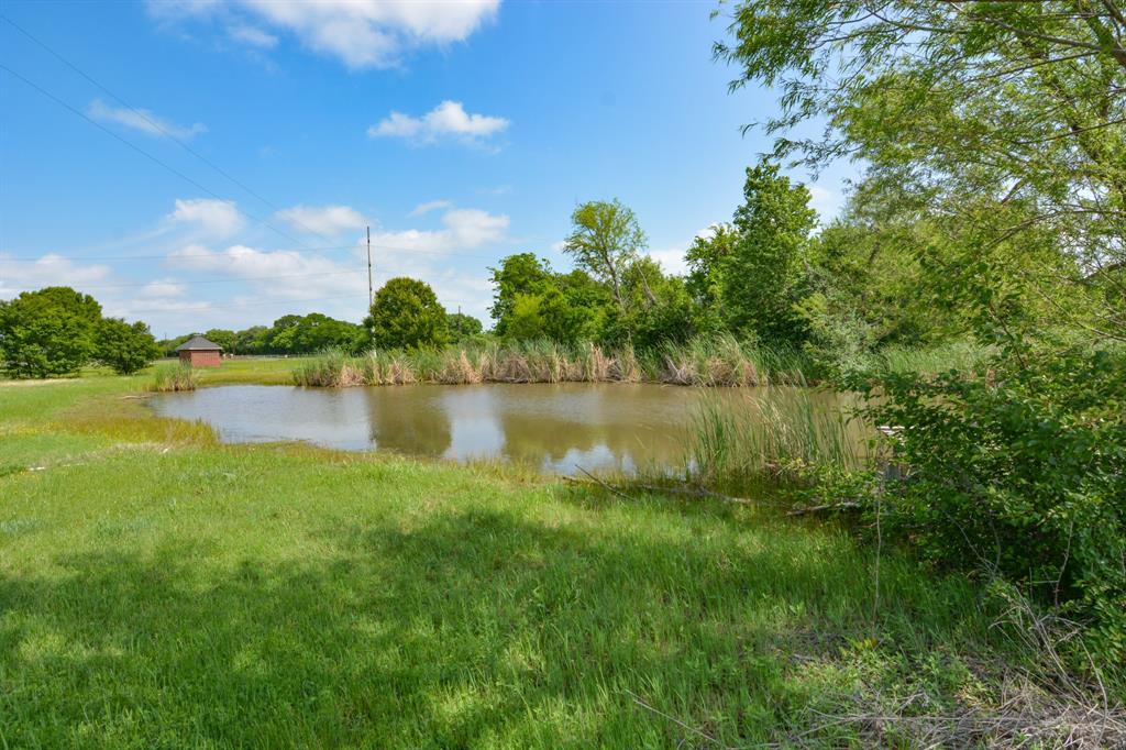 The perfect spot for your dream home! 5 fully fenced acres with beautiful mature trees, some pasture and a large pond. Plenty of room to build! Property includes a well and meter box in desirable neighborhood! No mobile homes.