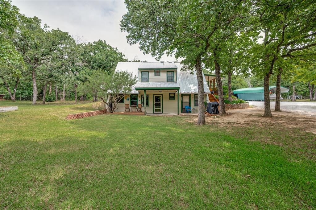 Nestled behind a tree line for added privacy, this updated 3 bedroom, 2 bath, 1 office home sits on just under 30 acres in the highly sought-after Alvord ISD. This home also features a flex space, perfect for a gameroom or workout room. Ag exempt with no known restrictions and endless possibilities, this property offers the perfect opportunity to build another home, create a family compound, or simply enjoy the peaceful country setting. The land is rich with wildlife and provides plenty of space to make your vision a reality, complete with a seasonal tank and chicken coop that add to the property’s farm appeal. A private water well with a water softener and private septic system are already in place, and the property offers easy access to Highway 287 while still being just a short drive to local schools. Whether you’re looking for a private retreat, investment opportunity, or room to grow, this property is ready for you to make it your own.