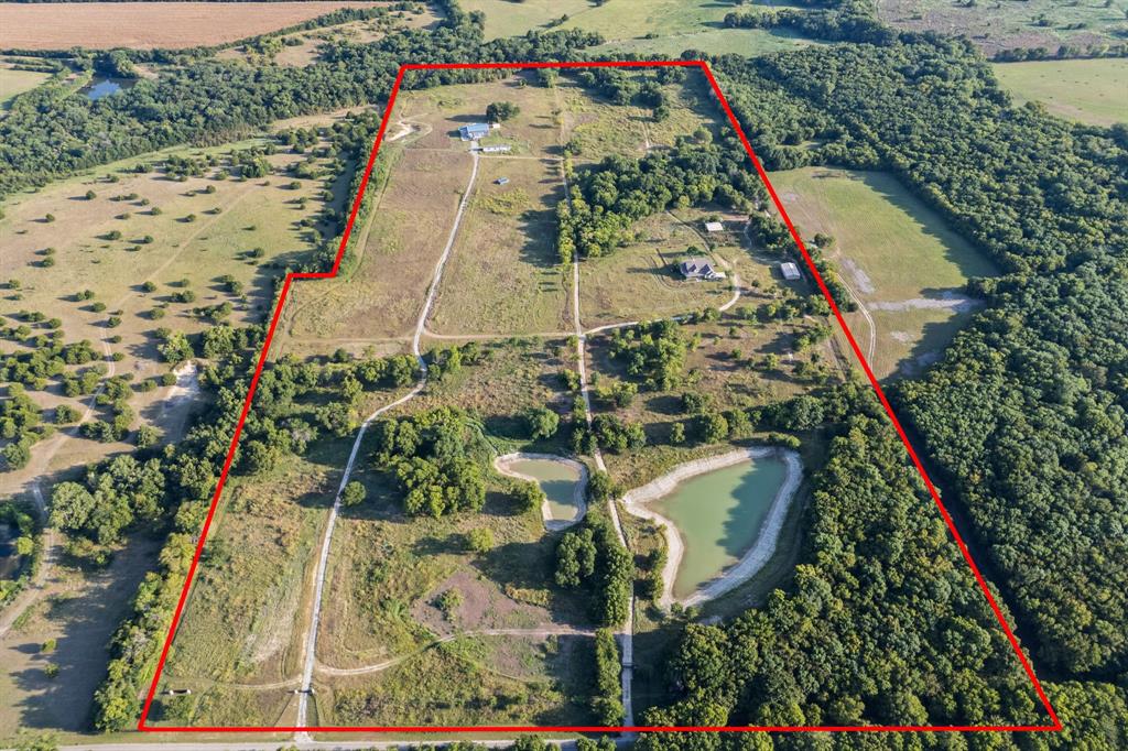 A 64.02-acre development assemblage in the direct path of Anna's growth — three contiguous parcels along County Road 581, positioned for a full master-planned single-family neighborhood in one of Collin County's fastest-expanding corridors. With roughly 1,164 continuous feet of frontage on CR 581, the tract offers generous, flexible primary access — room for a signature entry and multiple connection points to feed an internal street network.
This is a developer's canvas, not raw dirt. Electricity, water, and sewer already serve the property, with electric service, water (including an on-site well), and septic infrastructure already distributed across the acreage — a head start on horizontal cost and timeline. Topography is level to gently rolling. Held within the City of Anna's ETJ, the land can be divided at one acre per parcel under current septic guidance (pending review) as a conservative floor — but with sewer available to connect, the real upside is platting to municipal density and building out a full neighborhood, where every lot draws frontage from interior streets rather than the county road. Yield is governed by your lot program and net developable area, not by road frontage.
As rooftops push north out of McKinney and Melissa, contiguous acreage of this scale — with access, utilities, and a clear density path already in place — is increasingly scarce. Bring your engineer and your neighborhood plan. Survey, parcel detail, and supporting materials available to qualified parties.