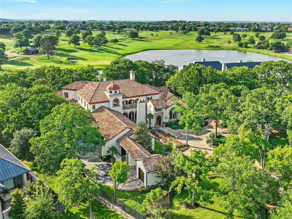 WOW! Nestled within the coveted Private Enclave of Gated and Guarded community of Vaquero in Westlake, this
extraordinary Estate is a RARE opportunity to own one of Westlake's MOST Breathtaking properties. Situated on a
sprawling 1.6+acre Homesite, this exclusive residence offers unmatched privacy, serenity & spectacular Views
overlooking a tranquil Pond & the picturesque 15th Hole of Vaquero’s Championship Golf course+ a priority spot on the waitlist for a golf membership. Enter the private gate into the motor court, you are greeted to a private Courtyard featuring timeless Architecture &
impeccable Craftsmanship. Rich in character & elegance & adorned with the highest quality Finishes throughout, this
home reflects refined taste & sophisticated design. Features include flanking French doors from front to back w
Breathtaking VIEWS, intricate Marble inlaid floors, Wood flooring, Venetian plaster, custom wood planked Ceilings and
extravagant Cast Stone fireplaces. Master Retreat boasts custom finishes w Bay Windows, custom
Cast Stone fp, Wet Bar, marble flooring & countertops w Antique Mirrors + 2 sep closets. The 1st flr is equipped
w 2 elaborate finished Studies, 2 Powder Baths, sub-grade Wine Cellar, Chef's Kitchen + Keeping Room, Elevator +
spacious Laundry. Upstairs has 2 lrg private Bed Suites, Game-Media, Exercise and lrg Balcony Patio w unmatched
Views. Attached to the home is a beautifully-detailed private Guest Quarters w bdrm, sitting area, kitchenette +
laundry. 4 car + golf cart garage. Backyard of your dreams with outdoor Din-Liv, FP, Pizza Oven, Spa, Fire pit, Putting
Green & tons of trees. This estate seamlessly blends indoor & outdoor Liv & expansive spaces designed for both
grand Entertaining & intimate everyday moments. Enjoy Sunsets from the patio, relax by the Pond or take in the lush
Golf course scenery. Every corner of this property offers a sense of peace & elevated living in one of
the most Prestigious communities in Texas.
