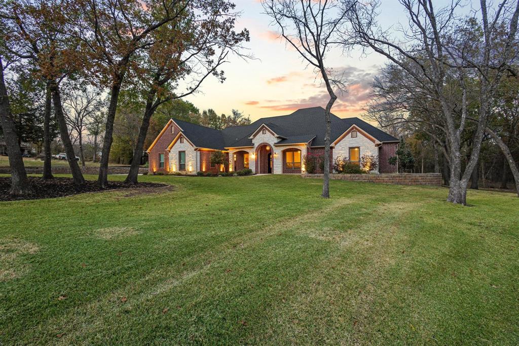 This spacious 4-bedroom, 3-bath home is set on 1.7 acres with a great layout for everyday living and entertaining. The primary suite features a large ensuite bath with a separate shower and soaking tub. In addition to the 3 bedrooms, the home includes a dedicated office, which can be a 4th bedroom, a game room that can be converted to a separate living space with ensuite bath, and a comfortable living room with a fireplace. The kitchen has custom cabinetry and plenty of workspace for cooking and storage. Step outside to an outdoor kitchen area that opens to a large backyard. Enjoy a pool with a built-in hot tub and stone surround, a putting green, and a fire pit area perfect for gatherings. Porch has automatic screens and fire pit wall. The lightly treed lot provides shade and privacy, and a small pond adds to the peaceful setting. This property offers room to spread out, relax, and entertain—both inside and out. A must-see for anyone looking for space, comfort, and a home built for enjoying the good life. Buyer and Buyer Agent to verify all info in listing is correct.