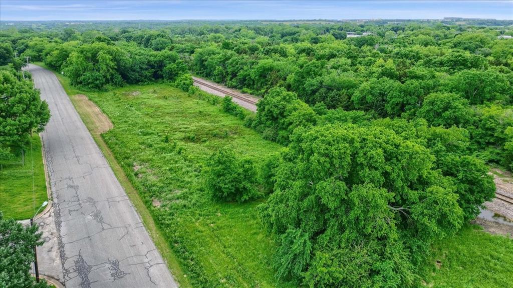 Developers and investors, Rare opportunity to buy 3.168 acres in town for First Street Townhomes in Sherman TX, OR plan your own multi Family Townhomes.  MF and in an development opportunity zone.  Minutes from the Texas Instruments 30 Billion Chip Complex to its presence in Sherman, TX. The area is booming with new homes and apartments trying to keep up with all the growth. Come and see its classic town and broad horizon.
