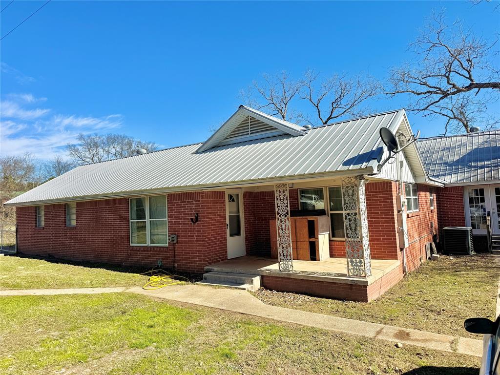 Tucked away on over 10 acres in Hawkins, this brick farmhouse offers the kind of space, privacy, and freedom that’s getting harder to find. With land that is partially cleared and partially wooded, this property feels like your own quiet retreat, the kind of place where mornings are slow, evenings are peaceful, and the owners say deer are a regular sight just beyond the back door.

Inside, the home features just over 1,900 square feet with 3 bedrooms, 2 bathrooms, and two separate living areas, perfect for gathering, relaxing, or creating flexible spaces that fit your lifestyle. One living area is anchored by a cozy gas log fireplace, while the other offers the charm of a wood-burning fireplace, giving you options for warmth year-round.

The floors are currently in a raw state, with plywood and boards in place, giving the next owner a blank canvas to choose finishes that truly make the home their own. It’s an opportunity to personalize the space from the ground up and bring your own vision to life.

Outside, the possibilities are just as expansive as the land itself. With no restrictions and a small pond, there’s room to build, whether that means additional homes for family, rental opportunities, or simply spreading out and enjoying the land as a true homestead. Private, peaceful, and full of potential, this property offers not just a home, but a lifestyle ready to be shaped by its next owner.