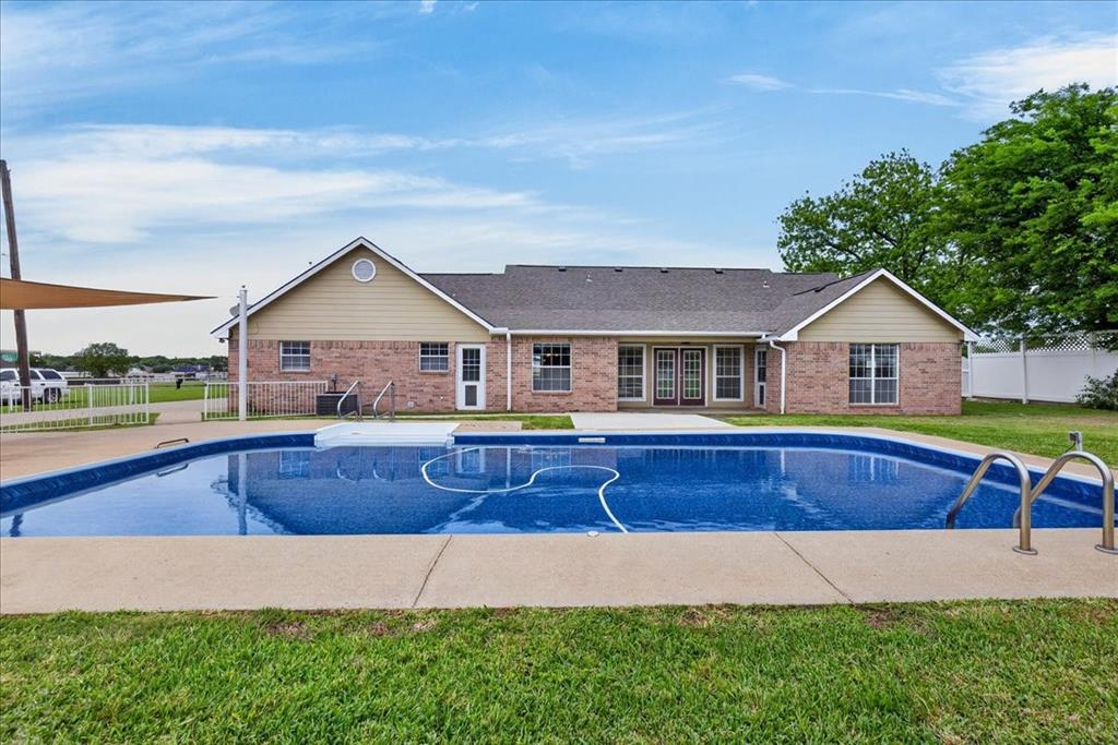 Beautiful brick home in the heart of Mabank, TX, just minutes from Cedar Creek Lake with easy access to Hwy 175. This 3 bedroom, 2.5 bath home features a functional layout with a formal dining area and a custom kitchen with granite countertops and ample cabinetry. Spacious living areas ideal for everyday living and entertaining. Enjoy a private backyard oasis with a pool, sun deck, and plenty of space for outdoor gatherings bbq. Property also includes a separate house 1 bed, 1 bath with open living and kitchen perfect for a mother-in-law suite, guest quarters, or potential rental income. Conveniently located near public boat ramps, dining, and entertainment. VA Assumable Loan