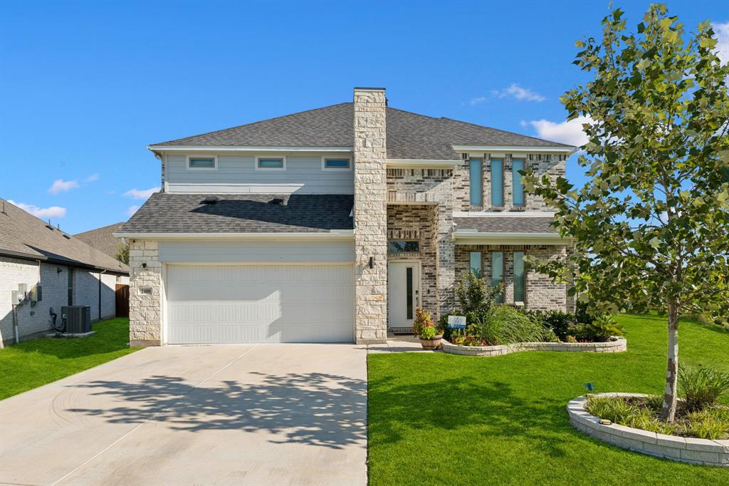 Better Than New! Built in 2023, this stunning rock and stone two-story home is situated on an oversized lot adjacent to a peaceful greenbelt in the sought-after Cibolo Hills community of Fort Worth. Offering an exceptional floorplan with 5 bedrooms, 3 living areas, an office, and 4 full baths, this home provides the perfect blend of style, comfort, and functionality. A covered front porch welcomes you inside where French doors open to a private home office. The open-concept living area features a decorative fireplace, ceiling fan, and beautiful backyard views, creating the ideal gathering space. The chef's kitchen is beautifully appointed with white quartz countertops, subway tile backsplash, white shaker-style cabinetry, a large island, breakfast bar, gas cooktop, built-in desk, coffee bar, and abundant workspace for everyday living and entertaining. The spacious primary suite is conveniently located downstairs and offers a relaxing sitting area, luxurious ensuite bath with dual white vanities, oversized walk-in shower, and a walk-in closet with custom built-in shelving. A secondary bedroom downstairs is perfect for guests or multigenerational living. The utility room includes additional shelving and space for a second refrigerator. Upstairs you'll find three generously sized secondary bedrooms, an oversized game room, and a separate media room, providing endless options for entertaining, movie nights, or family fun. Step outside to enjoy the covered back patio overlooking the expansive backyard with a wood privacy fence. The oversized lot offers plenty of room for a future pool, outdoor living area, and space to play, all while enjoying the added privacy of the neighboring greenbelt. This nearly new home combines modern finishes, a versatile layout, and an outstanding location to create an incredible opportunity you won't want to miss!