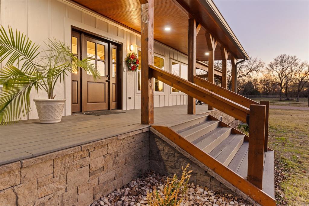 ***Priced Below Appraised Value—Major Reduction! Motivated Seller, All Offers Considered. This exceptional 52± acre retreat just outside the DFW Metroplex—35 min from Fort Worth, 55 from Dallas—has been reduced below appraised value, offering rare instant equity in a true ranch setting with metro accessibility. The property is accessed by two separate entrances for added convenience and flexibility. The main entry crosses Lockett Creek and passes a large fishing pond before reaching a canopy of majestic 300-year-old oaks framing the homestead. The 2,376± sqft farmhouse offers 4 beds, 3.5 baths, blending warmth, character, and modern comfort. An additional 4,000± sqft of decking and covered porches extend living outdoors—anchored by a grand stone fireplace with integrated entertainment center and a sprawling patio beneath the oaks, ideal for gatherings of any size. A 4-car cedar carport adds covered parking with timeless character. A true outdoor enthusiast's haven, the property features a stocked fishing pond, scenic trails for hiking and horseback riding, and abundant wildlife throughout. A rustic 2-bed, 2-bath guest cabin with a loft and wraparound porches are perfect for visitors, extended family, or short-term rental income. Equestrian and recreational improvements include a well-appointed 6-stall barn with upstairs entertainment and sleeping area, two full RV hookups, and 15+ acres of pipe- and cross-fenced pasture for horses or livestock. The wooded balance supports diverse wildlife and offers privacy and recreation in equal measure. A separate metal barn with concrete floors and roll-up doors provides ample storage for equipment, hay, and recreational vehicles. Now priced under appraised value, this Texas retreat delivers exceptional value alongside the character, infrastructure, and proximity to make it a true legacy property. Don't miss it—the seller is motivated, and all offers will be considered.