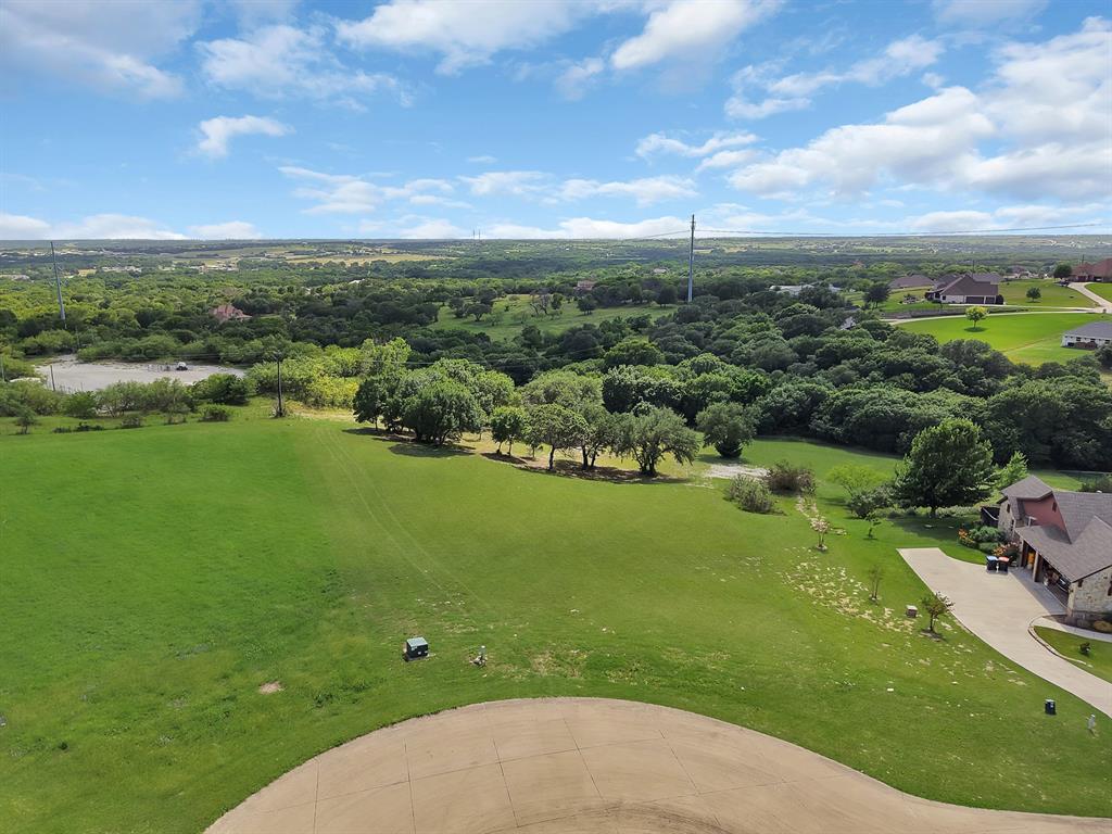 Build your dream home on this exceptional 1.9-acre homesite located in the prestigious gated Bella Ranch community of Fort Worth. Nestled among luxury custom estates and mature trees, this expansive lot offers the perfect blend of privacy, tranquility, and upscale country living. Enjoy plenty of space for a custom residence, outdoor living areas, pool, workshop, or guest house while still being just minutes from shopping, dining, Benbrook Lake, and convenient access to Fort Worth. This rare opportunity combines the serenity of acreage living with the amenities and prestige of one of the area's most sought-after neighborhoods. Bring your builder and create the home you've always envisioned.