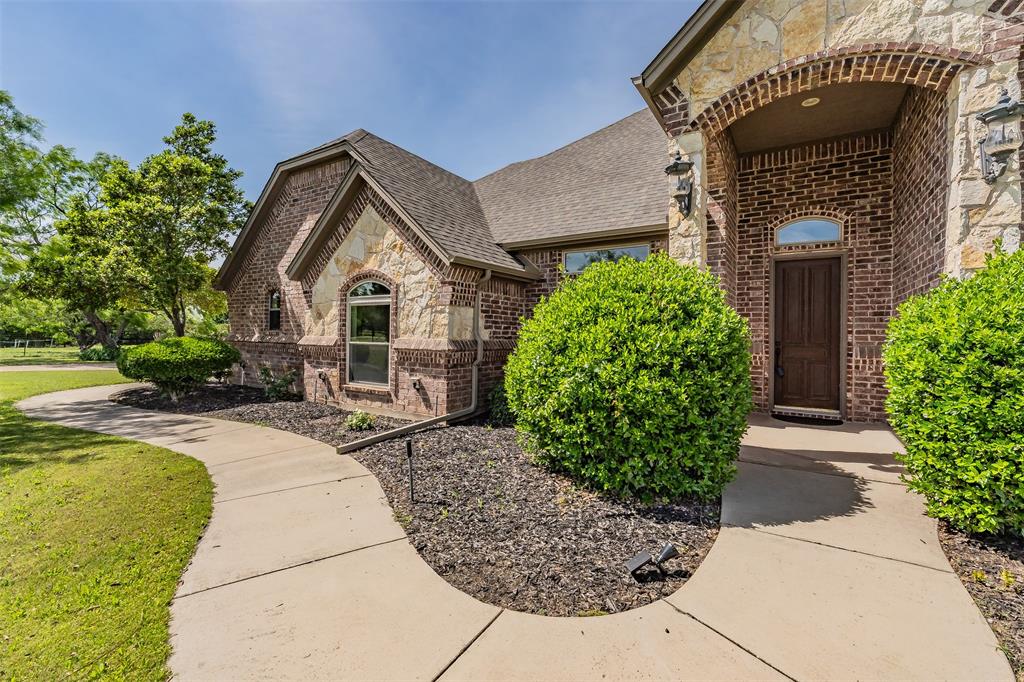 You CAN live in Paradise!!! Welcome to your private North Texas retreat in sought-after Paradise Country Estates—where wide-open spaces, serene pond views, mature trees, and everyday convenience come together. Situated on 2.5 scenic acres, this property offers the peaceful lifestyle buyers are searching for while remaining within easy reach of DFW dining, shopping, entertainment, and major highways. Located in highly regarded Paradise ISD, known for its exceptional schools, this property combines comfort, privacy, and community.
Inside, the thoughtfully designed open-concept layout features 3 bedrooms, 2.5 baths, split bedrooms, and a dedicated office perfect for working from home or flex space. The spacious living room is filled with natural light and centered around a striking stone fireplace with gas logs. The kitchen combines style and function with granite countertops, custom cabinetry, black appliances, and a walk-in pantry.
The private primary suite offers a spa-inspired bath with soaking tub, separate shower, dual vanities, and custom closets. Secondary bedrooms are connected by a convenient Jack-and-Jill bath.
Step outside and enjoy peaceful outdoor living surrounded by beautiful trees and tranquil pond views. Relax in the hot tub on the covered back porch, gather around the firepit by the fully stocked pond with catfish and bluegill, or create your dream entertaining space with the porch already plumbed for an outdoor kitchen. Plenty of room to entertain, garden, or simply enjoy the quiet beauty of country living.
Additional features include a 20x30 insulated spray-foam shop, RV cover, fenced rear acreage, water softener system, upgraded HVAC (2024), epoxy garage flooring, and generator plug setup.
All information deemed reliable but not guaranteed. Buyer and Buyer’s agent to verify all information including, but not limited to, square footage, schools, and features.
