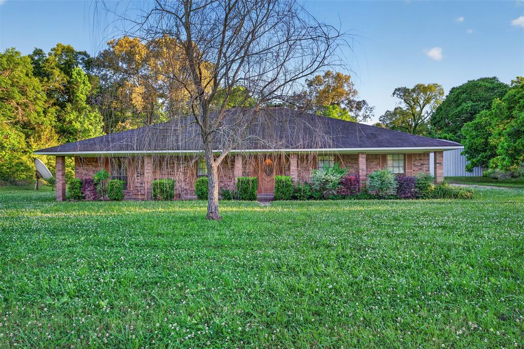 Situated on 6 acres, 401 Cane Bend Drive offers the perfect blend of space, functionality, and comfort in a peaceful setting. This single-story home features 4 bedrooms and 2.5 baths with a thoughtful layout designed for both everyday living and entertaining.

Inside, you'll find a spacious living area, a formal dining room, and a sunroom that brings in natural light and provides views of the back yard. The kitchen is equipped with granite countertops and a breakfast area, creating a welcoming space for gatherings. The primary bedroom includes a walk-in closet, while an additional office with custom built-in cabinets offers the ideal setup for working from home or managing daily tasks.

One of the standout features of this property is the impressive 2,166 square foot detached Quonset Hut, which was used as a woodworking shop and storage space, perfect for hobbies or projects. Additional amenities include a two-car garage and ample outdoor space to enjoy country living.

With room to spread out both inside and out, this property offers endless possibilities for those seeking privacy, workspace, and comfort all in one.  SEE PRIVATE REMARKS