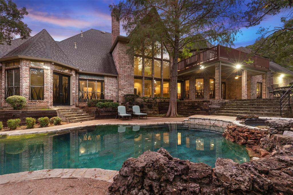Extraordinary heavily treed secluded property with a pond, greenhouse, and hard-to-find two plus acres of entertainment and recreation space!  Soaring ceilings greet you in the entry with a breathtaking curved staircase and upgrades galore!  The wall of windows in the family room overlook the back yard and pool area.  Well appointed chef's kitchen with island has plenty of room for multiple chefs.  One garage is set up as a home gym, and can easily be converted back to parking.  Flex space over the garage is great for a second office, media room, additional game room, home school classroom, etc.  Must see this one to believe it!