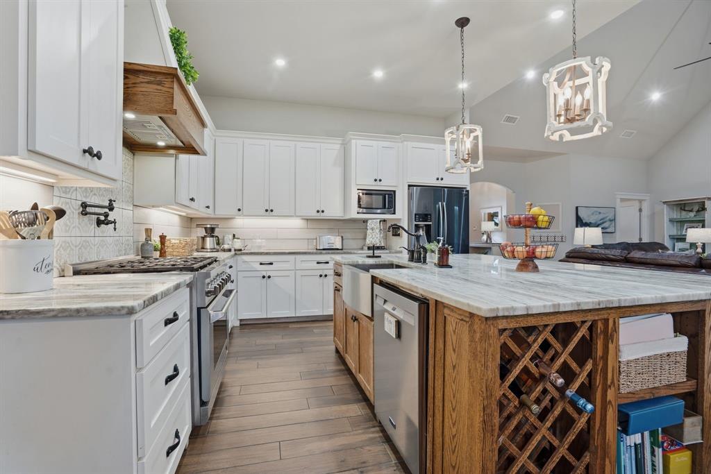 A rare opportunity to own what most buyers can’t find—modern construction without the wait, compromise, or unfinished feel. This 2021 custom home is a rare balance of modern innovation and natural beauty. Nestled on 1.17 acres with a scenic creek, the setting feels private and serene, offering the kind of space and tranquility that is increasingly difficult to find. From the moment you step inside, the difference is unmistakable. Thoughtfully designed with elevated finishes rather than builder-grade selections, the home reflects a higher standard of living. The kitchen anchors the space with an oversized island designed for gathering, upgraded granite surfaces, and a commercial-grade cooktop creating an environment equally suited for quiet mornings and lively entertaining. The interior layout is both functional and refined, offering 5 bedrooms, 3 full bathrooms, and private game room upstairs. The primary suite is a true retreat, featuring a spa-inspired bath with a steam shower enhanced by aromatherapy steamers, a soaking tub, and granite finishes that evoke a sense of calm and indulgence. Every detail has been considered for both comfort and experience. Energy-efficient features—including full spray-foam insulation and triple-pane windows—provide a level of quiet, efficiency, and year-round comfort that complements the home’s luxury feel, while a wood-burning fireplace and custom cedar outdoor shower add warmth and character. What truly elevates this property beyond new construction is what time has already created. Mature landscaping, growing shade trees, and established flower beds frame the home beautifully, offering immediate curb appeal and a sense of permanence. There is no waiting, no additional investment just the enjoyment of a property that already feels private and welcoming. This is a refined, move-in-ready retreat that seamlessly blends modern performance with established charm, offering a lifestyle that is both elevated and effortless.