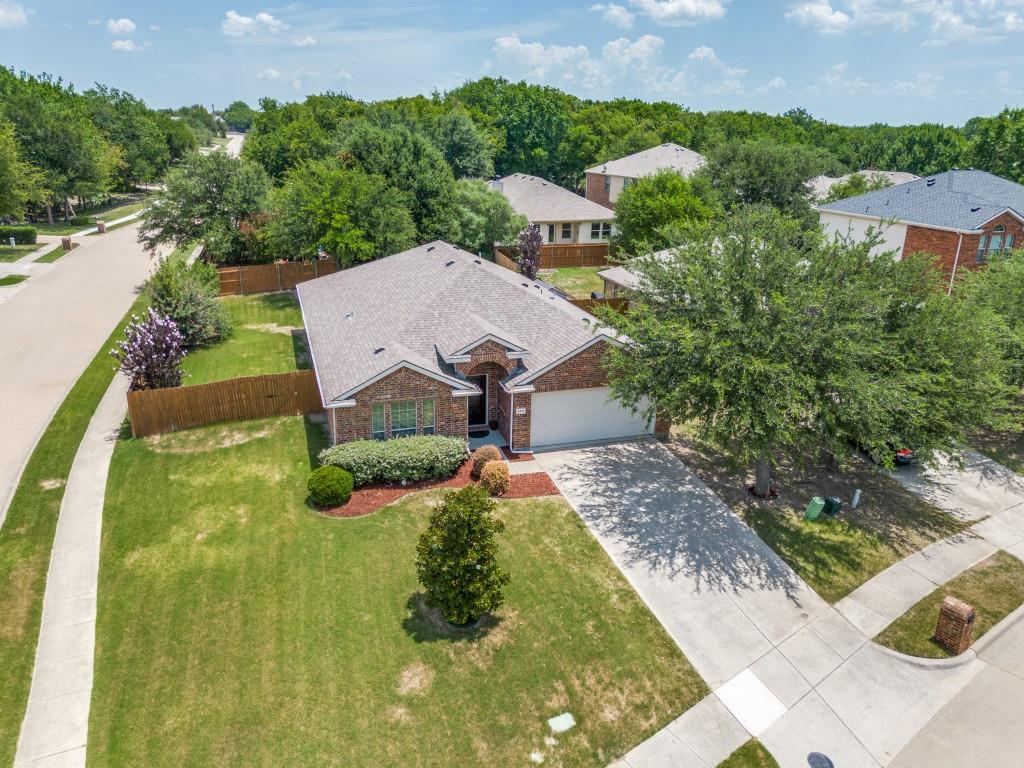 BEAUTIFUL one-story, hard-to-find 3-BEDROOM, 2-BATH home with a 2-CAR Garage with Epoxy Flooring + BONUS designated OFFICE - ALL under $400K in PROSPER ISD! This is the one buyers have been waiting for—well-maintained, clean, move-in ready, and sitting on a desirable .20-ACRE CORNER LOT with a large TEXAS-Sized BACKYARD, plus notable updates including RECENT ROOF and HVAC replacement. Step inside to an easy-to-love Split Floor plan with tile flooring throughout the main living areas, a spacious open living and dining area, and a well-designed kitchen featuring abundant Counter Space, BREAKFAST BAR Seating, stylish Wood Cabinetry, STAINLESS STEEL Appliance, and seamless flow into the main living spaces. The designated laundry room is conveniently located off the kitchen, while the PRIVATE OFFICE with French doors adds the perfect flex space for working from home, studying, a playroom, hobby room, or possible guest space. The backyard delivers the outdoor space everyone wants with mature trees, two patio areas, sprinkler system, and plenty of room for summertime grilling, pets, play, and entertaining. Tucked into a quiet, small-community setting with low turnover and neighbors often seen walking their dogs, this home is also close to Baylor Scott & White Medical Center – McKinney, Costco, West Grove at 380 & Custer, and abundant shopping, dining, and entertainment along the growing Hwy 380 corridor. A 3D tour and floor plan with measurements are provided to help buyers envision the home’s layout and possibilities. A rare opportunity to get into Prosper ISD at an attractive price point with time to get moved in before school starts—don’t miss it!