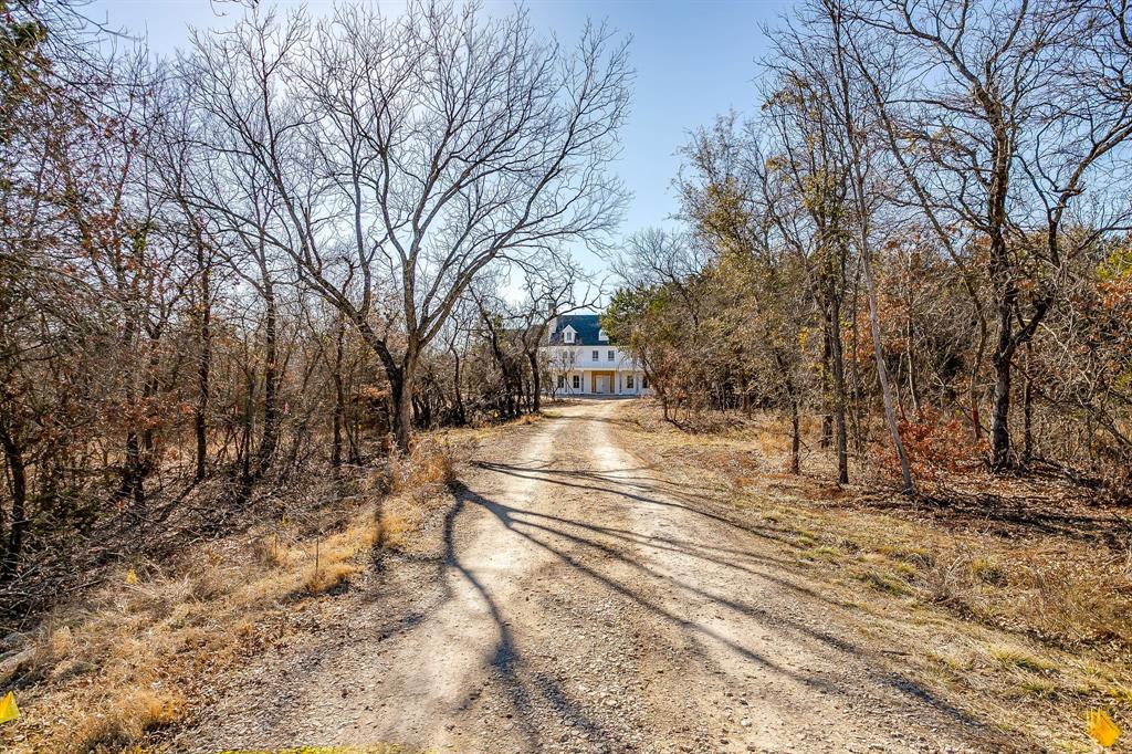 A classic Colonial build set back from the road down an iconic tree-lined driveway, this timeless home is perched on a hill toward the end of a one street cul-de-sac, in the highly desired, upscale Aledo River neighborhood. It offers stunning finishes, amenities, layout and a densely treed two acre lot.  While still under construction, upon completion this will be a masterpiece of design. The quality of this Provender Home is evident throughout with special attention to livability. The location offers privacy and seclusion while being in one of the most accessible, convenient and coveted pockets of Aledo ISD. The drive down Jenkins Rd exudes Texas Hill Country at its finest. Owners in the Aledo River neighborhood may access Jenkins Rd from both Bailey Ranch Rd and Bankhead Hwy through use of a fob to operate the Jenkins Rd gate.  Close proximity to an extensive hike & bike trail system. Fantastic opportunity for both luxury & convenience. Estimated completion March or April 2026. Please reach out for details.