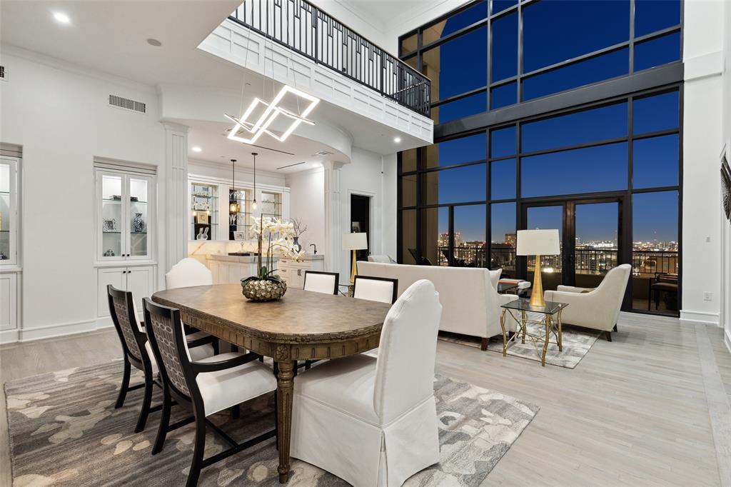 This two level penthouse offers dramatic ceilings and spectacular city views. Completely renovated, this light and bright residence has handsome hardwood floors, expansive walls of windows, and a functional floor plan. The grand living and dining area with great views is ideal for hosting dinner parties. Adjacent is a chef's kitchen with white and blue cabinetry featuring an island with striking countertops and backsplash that are great accents. A bar and lounge showcases lighted onyx countertops, mirrored shelving, an abundance of cabinetry, and wine room with wine refrigeration. Two guest suites are on the lower level, split for privacy and offer nice walk-in closets and ensuite bathrooms. On the second level, the office is a perfect place to work from home with stunning views to the city. The primary bedroom is serene with a spa-like bathroom. The Plaza II building offers 24-hour concierge service, valet parking, pool, workout facilities, business center.