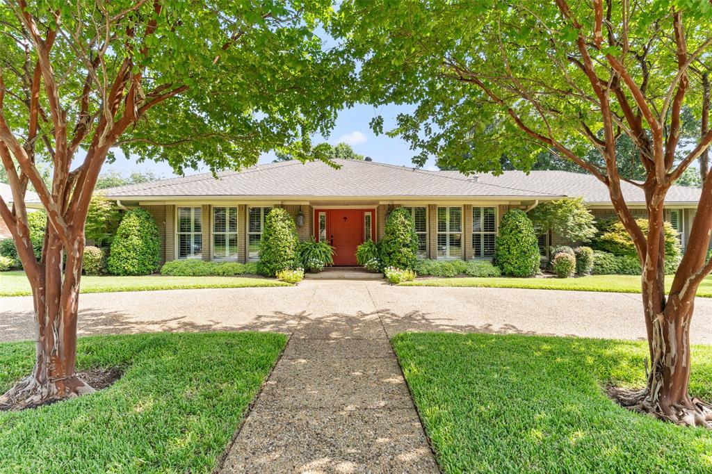 Nestled on a beautifully landscaped lot,4024 Fawnhollow Drive offers timeless design, exceptional updates,& effortless indoor-outdoor living. Listed $15,000 below appraised value,this meticulously maintained 4-bedroom,3-bathroom residence spans 2,788 sqft & combines classic architecture w thoughtful modern improvements.The circular driveway, mature trees,& lush landscaping create unforgettable curb appeal.Inside, rich wood flooring, Pella windows & slider, elegant plantation shutters, built-in speakers,& abundant natural light enhance every space.Designed for both comfortable everyday living & entertaining, the home offers two spacious living areas, a formal dining room,& a bright breakfast area overlooking the backyard.The expansive family room features beamed ceiling ,a floor-to-ceiling stone fireplace, custom built-ins,& seamless access to the outdoor living space.The well-appointed kitchen offers granite countertops, generous cabinetry, stainless appliances, a center island w a gas cooktop,& excellent flow into the breakfast room & family room.The private primary suite features two walk-in closets & a beautifully updated en suite bath w dual vanities, granite countertops,& an oversized frameless glass shower.Step outside to your own private retreat.The covered outdoor living area overlooks a  heated pool and spa, recently upgraded w PebbleTec finish & a recent pool sweep, creating the perfect setting for year-round entertaining or relaxing weekends at home.Outdoor lighting enhances both the beauty & ambiance long after sunset.The flexible split-bedroom floor plan provides privacy for family & guests alike, w spacious secondary bedrooms & well-appointed baths.Ideally located w quick access to the Dallas North Tollway, I-635,&US-75 for an easy commute throughout the Metroplex, this exceptional home enjoys convenient access to shopping ,& everyday conveniences, revered private schools, parks,g olf courses,& major employment centers.