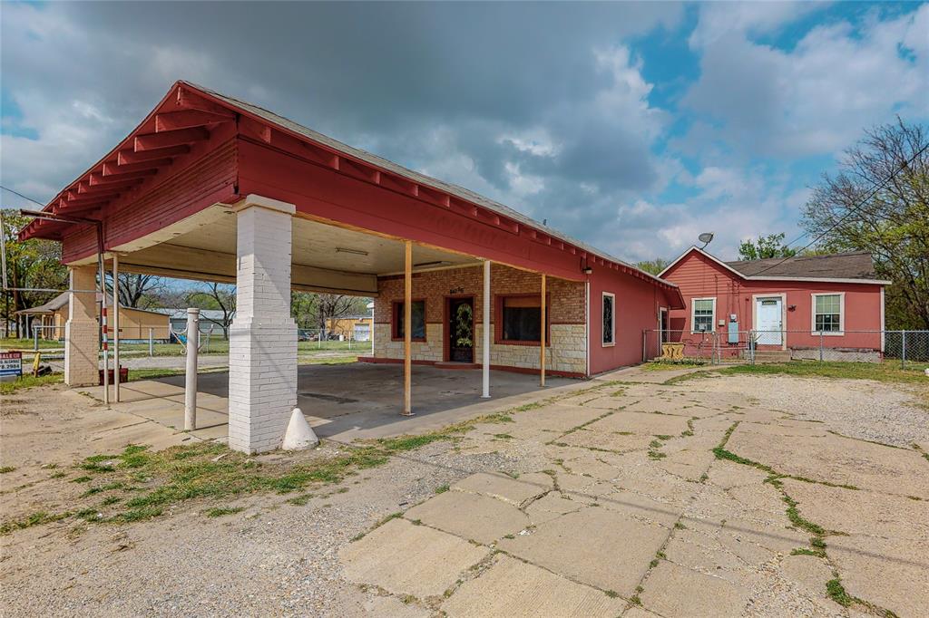 Previous laundromat-fully remodeled interior and exterior converted into a hair salon with updated HVAC, flooring, plumping and electrical throughout in 2013 and 2014 roof replaced 2023! Building includes a kitchen as well as office space and a bathroom with a stand-up shower. Purchase of the building comes with a 2-bedroom 1 bath, 1120sf home just steps away that would be perfect for the business owner or used as a rental investment home. A lot of parking space on front, rear and both sides of the building with a gate installed. House is currently occupied. This property has a lot of opportunity and is ready for its new business owners! Property is zoned Industrial 1, No survey available, buyer will have to purchase new. See residential listing details MLS 21221807