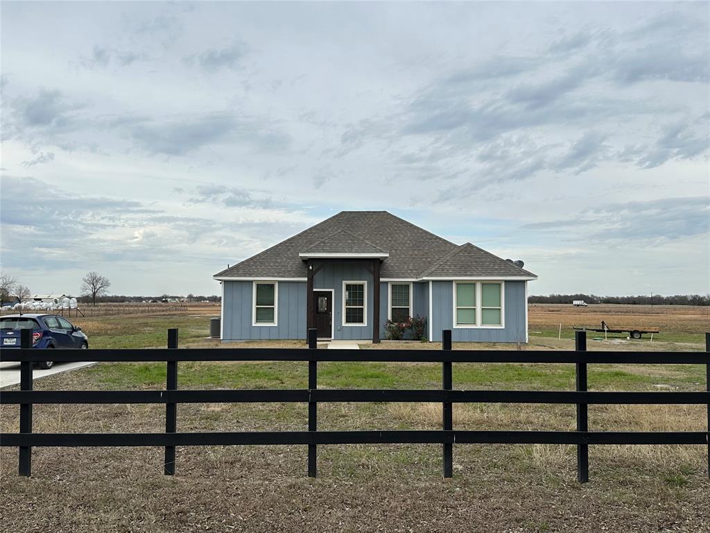 Welcome to this charming 3-bedroom, 2-bath single-family home situated on approximately 7 acres in the peaceful countryside of Commerce, TX. This 1,600 sq ft residence offers an open floor plan with the living area flowing seamlessly into the kitchen, creating a functional and inviting space. Interior features include laminate flooring, recessed lighting, ceiling fans, granite countertops, a kitchen island, and ample cabinetry. Step outside to enjoy the covered back porch with cedar accents, overlooking open pasture land—perfect for relaxing and taking in the country setting. Conveniently located near town with easy access to local stores and restaurants, this property offers the ideal balance of quiet country living and everyday convenience. Set your appointment and see this beautiful home TODAY! BUYER AND BUYER AGENT TO VERIFY ALL INFORMATION AND MEASUREMENTS.