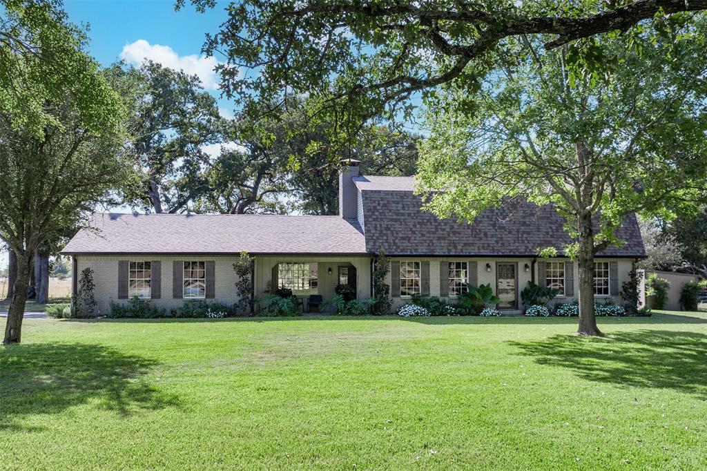 Welcome to country living with style and space! This beautifully updated home sits on +or -11.5 acres in thriving Kaufman County, offering room for everyone—plus all the animals, projects, and hobbies you can dream up. Inside, you’ll find dreamy wood floors, custom details, and a kitchen that’s truly to-die-for—perfect for gathering with family and friends. The flexible floor plan makes it easy to spread out, while large windows bring in natural light and showcase the peaceful surroundings. Step outside to enjoy the lovely landscaping, native shade trees, and an expansive covered back porch designed for year-round outdoor living or entertaining. It’s the ideal spot for morning coffee, evening sunsets, or hosting your next BBQ. For those with hobbies, business needs, or big projects, the property features a 30x50 insulated shop with water & its own electric meter—a rare find! Detached covered parking adds convenience and protection for your vehicles or equipment. Whether you’re dreaming of a working ranch outside of the city, a private retreat, or simply wide-open space to breathe, this property has it all. Easy reach to HWY 175, I-20, and HWY 80, giving quick access into Dallas, Rockwall, or East Texas lake country. Only about 30–40 minutes from Downtown Dallas, making it easy to commute. Experience the perfect blend of a laid back rural lifestyle and urban accessibility—plenty of land to spread out, yet close enough to the city for work, entertainment, shopping, and dining. This is more than a home—it’s a lifestyle. Don’t miss the chance to make this your forever place in the country!