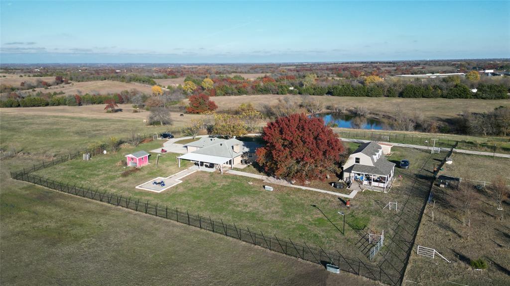 OWNER FINANCING AVAILABLE. Breathtaking views from one of the highest points in Grayson County! There is NO flood zone on the property. There are 2 houses on this property; details below. This exceptional property is perfect for weekend retreats, your future dream home, or an incredible investment opportunity. With stunning evening sunsets, a small lake for fishing and paddle boating, and multiple producing pecan and fruit trees, this property offers both beauty and functionality. 
The main house (2500 Sqft) features 4 bedrooms, 3 full bathrooms, a game room, a formal dining area, and a recently remodeled kitchen—ideal for comfortable living or entertaining. Additionally, there’s a guest house (1500 Sqft) with 2 bedrooms, 2 full bathrooms, a spacious living room, and a large kitchen with ample storage and counter space. (The property is currently rented).
For ranch enthusiasts or agricultural use, the property includes:
• A large metal barn-workshop for storing equipment or ATVs
• A cow barn, catch pen, and loading chute
• Cross-fencing for livestock management
• A storage shed for added convenience
Location Highlights
• Opposite Grayson County Speedway and adjacent to Willowood Ranch & Chapel (300+ acres).
• Just a 15-minute drive to Sherman, TX, home to $29 billion investment from Texas Instruments and $5 billion from GlobalWafers 
Potential Uses
This versatile property offers endless possibilities:
• Ranch or horse property
• Residential subdivision (utilities available to serve up to 70 lots)
• RV park or Airbnb vacation rental opportunities
• Event venue for weddings or retreats