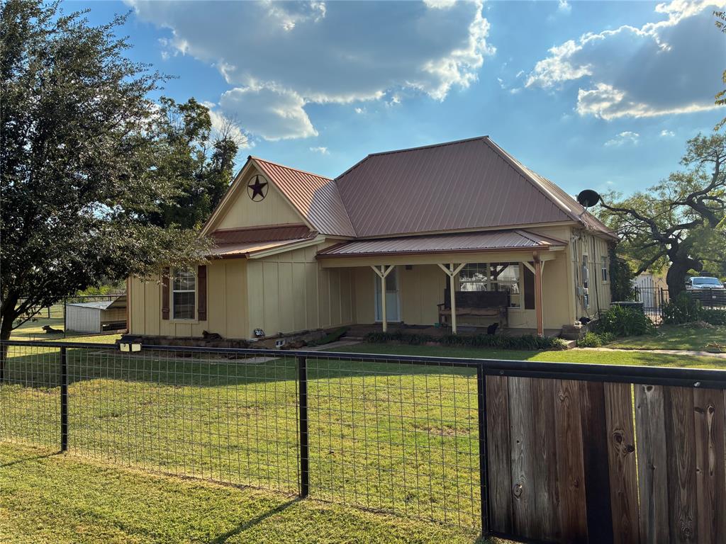 One of a kind property in Millsap. Property has many improvements including metal roof, new piers and foundation work, HVAC replaced in July 2025, custom made solid wood cabinets in the kitchen, bath and laundry room, fresh paint inside, new carpet in all bedrooms, water filtration system, 12x36 covered back deck and  lawn sprinkler system. Detached garage with large backroom ideal for storage or an additional living area. Property is completely enclosed with a pipe and no climb wire fence and includes a large open pen for dogs or other animals. 2 stall (could be 3) horse barn with tack room and round pen. Large covered area off of the barn is ideal for parking equipment or vehicles.