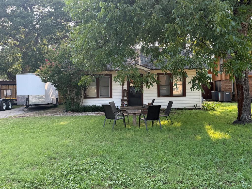 3 bed 1 bath home in Eastland on a large lot with mature trees and a fenced backyard. Original hardwood floors throughout. Updated bathroom. Central heat and air. Gas water heater. Two carports plus additional storage buildings and a large workshop on the property. Convenient to Eastland ISD, Eastland Memorial Hospital, and I-20. Priced to reflect condition and opportunity.