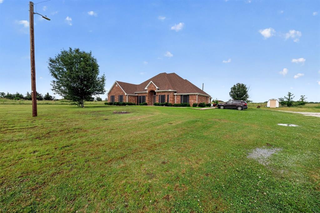 Two beautiful eye-catching spacious homes with new roofs are nestled on 201.34 acres of cleared land. One brick house is a deep red with 4 bedrooms; two and a half bathrooms Ceiling fans are in all the rooms. The master bathroom has built-in seats for safety, with a 2-car attached garage. The house has over 3,000 square feet of an open floor plan for family living, enjoyment, and entertainment. This lovely house includes a family dining room, a cozy breakfast area, a large family-sized walk-in pantry, and plenty of cabinet storage as well as storage under the counters and center island. French doors enclose the private office space. A front porch provides peaceful space to sit and enjoy the environment while be back patio with ceiling fan provides a comfortable space for relaxing and entertaining with family and friends. The second house is a welcoming reddish-brown color with over 3,000 sq. ft. of living space. It has 4 bedrooms, 3 full-size bathrooms with an attached two car garage. The master bedroom has space for sleeping, sitting and eating. Ceiling fans are throughout the house as well as large walk-in closets. Formal living and dining areas provide separate space for family gatherings. The kitchen has 2 pantry areas and lots of storage space under the kitchen island and counter tops. There is easy access to the 201.34 acres of land off the paved farm to market road. The land is cross fenced for rotational grazing purposes.