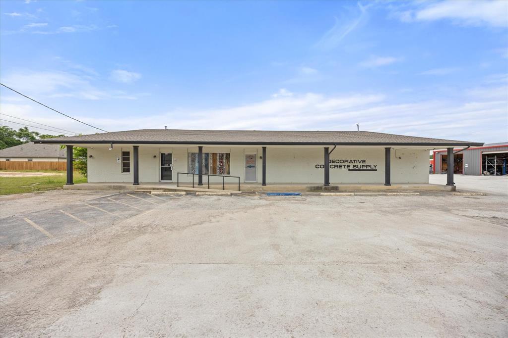 Prime commercial opportunity in the heart of the business district! Strategically located in a high-traffic corridor with approximately 160 feet of road frontage, this versatile, well-maintained property is ready for your vision. The front building offers 4,800 SF of air-conditioned space, plus an additional 3,600 SF metal building — 8,400 SF total. Equipped for large truck deliveries and adaptable to a wide range of uses including restaurant, retail, offices, manufacturing, distribution, or recreational. Interior features include an open floor plan to design your own space, two private offices, a kitchenette, a supply area, and separate men's and women's restrooms. Abundant space with the flexibility to retrofit to any business model. Location, infrastructure, and versatility—this property has it all!