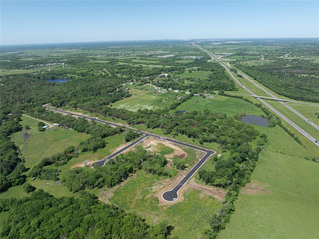 OPTION FOR OWNER TO CARRY MORTGAGE with as low as 10% down. Towering Oaks is a custom build community featuring 29 premium sized lots already equipped with completed entry way, access to electricity and water.  This expansive property boasts a tranquil rural setting while conveniently located just a short drive from city amenities with no city taxes.  Whether you're envisioning a custom-built home or development opportunity, this versatile plot provides the perfect canvas. Over 1 acre lots starting at just $94,900.