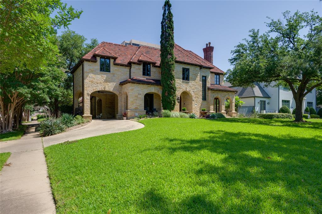 Nestled in the heart of University Park, this custom, 5970 SF all stone home with Ludowici tile roof sits on a corner lot, offering an ideal blend of elegance & comfort. Upon entering, the formal living & dining areas welcome you, while the study with built-ins provides a versatile space for work. The chef's kitchen, recently remodeled to perfection, features a large island, double oven, &  stone-outlined gas cooktop, all seamlessly flowing into the breakfast room & oversized den with a vaulted ceiling & fireplace.The second floor hosts 3 en-suite bedrooms, office, & an oversized primary suite offering a tranquil haven with a fireplace, double vanity bathroom, & 2 large walk-in closets. The 3rd floor presents an expansive bedroom with en suite bath. Outside, the landscaped backyard beckons with a covered stone patio, built-in grill, a lush grassy area & rare 3 car garage plus Porte Cochere. Home is conveniently located within walking distance to parks, shops & dining in Preston Center.