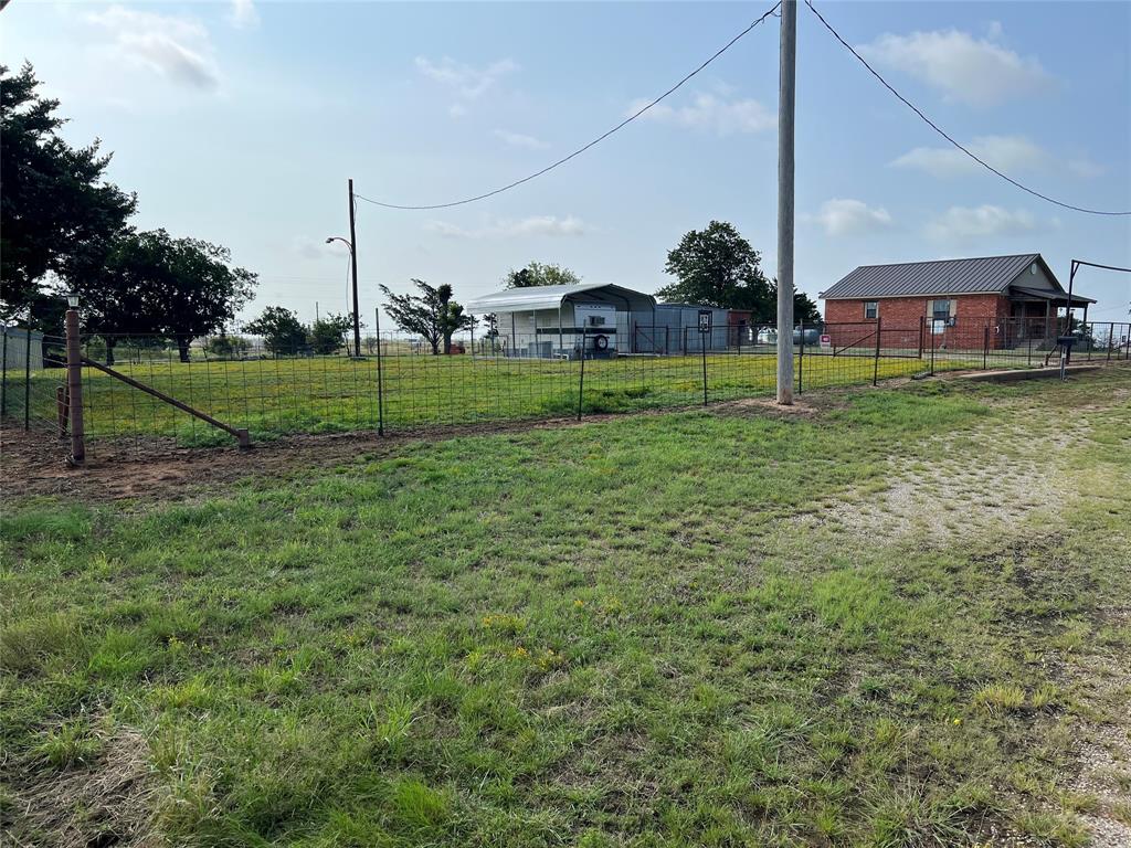 Call this 1+-ac home! 2-2 unfinished metal roof brick with recent plumbing, windows & connected elec. Unmatched location on outer edge of the city limits. Manageable access on & off FM frontage with pipe gate entrance. Picture book polished property cleared & ready for a new owner to create their own field of dreams. Great way to start any day from every angle of this little elevated perch. Totally enclosed & all tied together with perimeter, cross fencing, scattered trees, & security lights on the property. Property is fully equipped with a recent water well categorically placed to allow for any big picture idea. Camper is included with covered car carport with its own bathroom, shower, stove, fridge, & year-round heat & air window unit. Perfect place to stay while you finish out the house. Want everyone to be included just add reserve electric hook ups & bring one & all for a part-time recreational getaway. Concrete slab already in place with RV hookup & water valves in needed places around the property. Lean too for pets or livestock. This property doesn’t stop there; it also has a wow factor insulated gathering building. Absolutely great for large get togethers any season of the year as it has room for a window unit to be installed & propane stove that goes with sale. Front covered porch with make you feel like doing nothing views. No worry when leave front locking gate. Short drive to Lake Nocona or the Oklahoma Casinos. Nocona hosts old historic buildings that were once home to familiar family-owned businesses & some have been restored into new modern-day ideas that continue to grow our downtown with local eateries, bars, shopping, pharmacy, hospital, flowers & gifts, coffee shops, barbers, cigar shops, leather goods, city park, lake, art, or live downtown in one of our coming soon apartments…all these are just to name a few of what our community has to offer. Year-round activities including our own Nocona Style Mardi Gras! Survey will need to be completed.