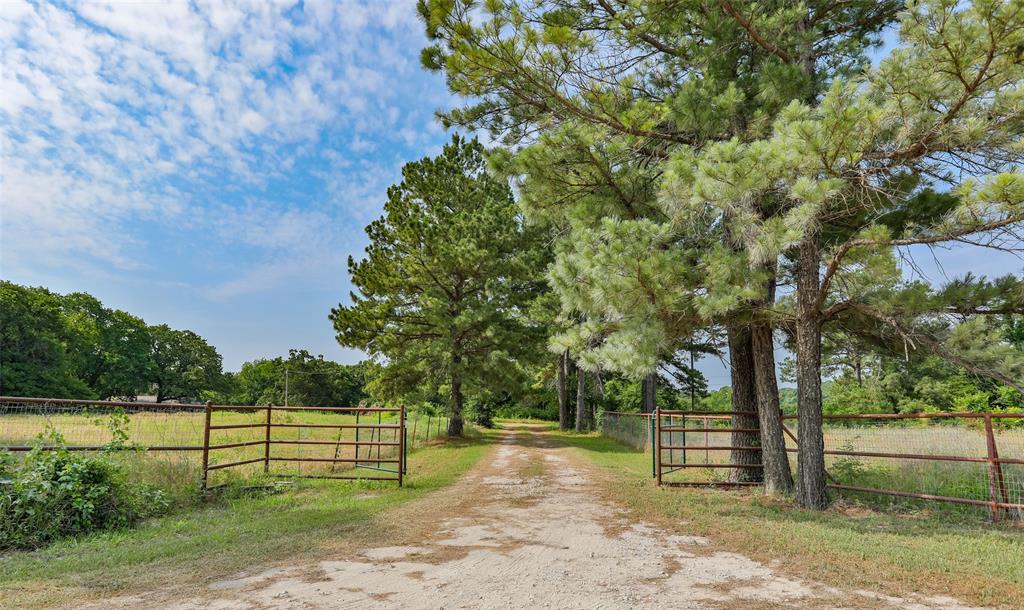 Unwind from the grind! House, hunting cabin, recreation, trees, acreage, pastures, pond, privacy...PERFECTION!  About an hour from the Metroplex, it's an easy trip to this 92 acres of peace and quiet.  Also, near the small town charm of Valley View and Gainesville, you'll be just minutes from fun and games at Winstar World Casino and fun on Lake Ray Roberts.  The pine tree lined drive up to the home transcends you to the days of southern charm confirmed by the 4200 sq ft of living space, the 6ft wide majestic staircase and pride in construction. The perfect retreat for gatherings with family and friends!  The hunting cabin could be your man cave, she shed, MIL suite, office, party barn or game room!