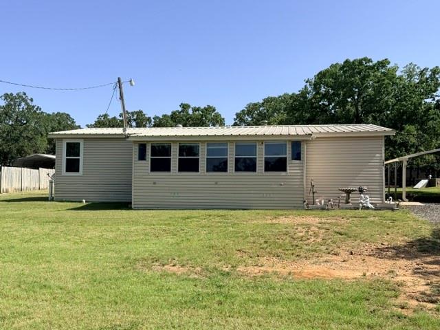 Escape to peaceful country living just minutes from Amon Carter Lake!  This well-maintained 3-bedroom, 2-bath retrofitted mobile home offers comfort, functionality, and plenty of space both inside and out.  The interior features beautiful granite countertops, durable laminate flooring, decorative wainscoting, and self-cleaning for easy maintenance.  A spacious 21'x12' enclosed patio provides the perfect spot for year-round entertaining, relaxing, or enjoying your morning coffee.  Outside, the property is packed with valuable amenities, including a well house with additional storage, a 30'x40' lean-to with electricity, a hobby house ideal for projects or crafts, a separate storage building, a two-car covered carport, and an additional enclosed covered carport for extra vehicle or equipment storage.  Whether you're looking for a full-time residence, a weekend getaway near the lake, or a property with room for hobbies and outdoor living, this one has it all.  Enjoy the tranquility of country life with convenient access to boating, fishing, and recreation at nearby Amon Carter Lake.
