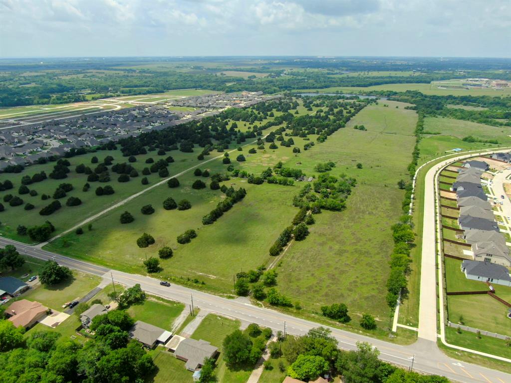 Rarely does a site of this caliber come to market. This stunning 120-acre waterfront tract offers unmatched development potential in one of the DFW Metroplex's fastest-growing corridors. Currently zoned SF-1, the property sits flanked by two established residential communities zoned SF-2 and PD-SF-3, demonstrating a clear market precedent for density and providing a compelling case for rezoning or planned development designation. Direct lake frontage and mature scattered hardwoods create exceptional natural amenities that translate directly into premium lot values. A 24-inch water line at the street significantly reduces infrastructure risk and accelerates project timelines. With strong rooftop density surrounding the site, proven neighborhood absorption on both sides, and explosive population growth driving continued demand, this is a generational land play. Whether your vision is a master-planned residential community or a mixed-use development blending retail, commercial, and residential, this property delivers the location, infrastructure, and natural setting to execute at the highest level.