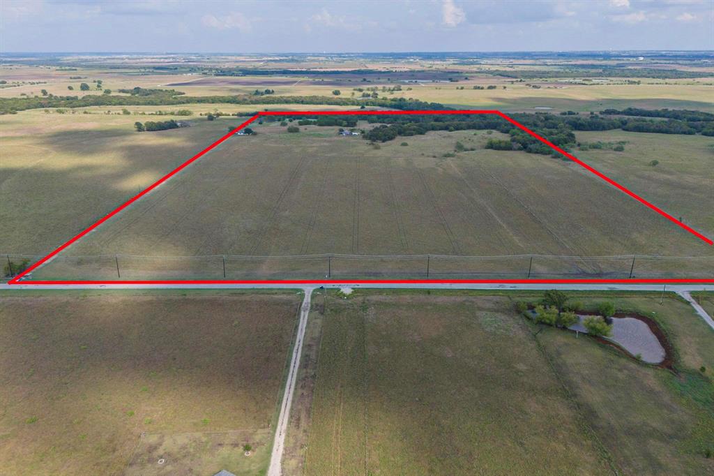 Location !! Location !! INVESTORS and LAND DEVELOPERS WELCOME !! The sought-after Pilot Point offers gorgeous and awesome 61.523 acres of land. It is surrounded by new developments and communities coming up. The property has a charming and private 3 bedroom, 2 bath ranch house is located on a farm and ranch lot of approximately one acre in Pilot Point. Beautiful views from all windows. The spacious master bedroom has dual walk-in closets. The kitchen includes updated appliances with lots of counter and cabinet space. Spacious open concept includes a large wood-burning fireplace. The property uses propane for central heating and cooking.  The house needs some repairs and work.