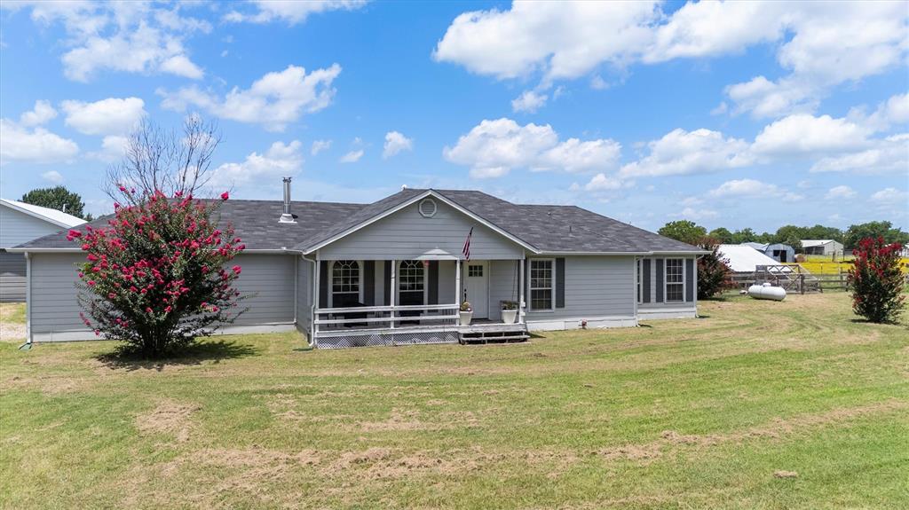 Come experience true country life on nearly 2 acres in this adorable 3 bedroom farmhouse with recently added detached fully functional 1 bedroom apartment.  Enjoy the main home with ample patio areas, cozy woodburning stove and unique decor.  Primary bathroom has been tastefully updated, large kitchen that is plumbed for gas, generously sized living and dining area.  Additionally, the recently added detached apartment features an open concept kitchen, separate bedroom and laundry area.  There is already a small barn or loafing shed ready for you to bring your farm animals, plant your garden and enjoy cooling off in the large pool.  Property has multiple fenced areas to separate animals or gardens.  Square footage includes the detached apartment. Large detached shop or garage.