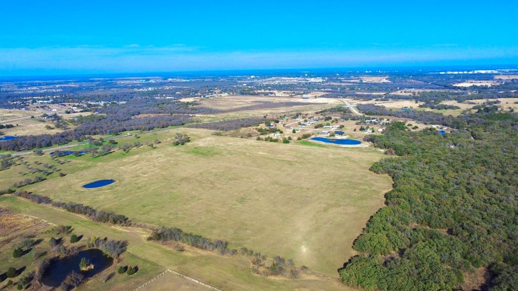 Just over 65 acres, located just west of Corsicana, immediately outside the city limits on the HWY 31 Loop Bypass. Offering an excellent development opportunity. This tract offers over 900 feet of road frontage on the HWY 31 LOOP. It can be sold with additional available adjoining acreage as well. Positioned at the highly trafficked SH 31 Corsicana Bypass, this property benefits from exceptional exposure in a rapidly growing, high-traffic area. With tremendous potential for future development, this tract is ideal for investors or those looking to capitalize on expanding infrastructure. More acreage available MLS # 21134183, 21134270, 21134262, 21134269. Property will have deed restrictions including no dumping, junkyards, hog farms, or manufactured homes. ACCESS, UTILITY AVAILABILITY AND COST SHOULD BE VERIFIED BY BUYER. EXACT ACREAGE AND ROAD FRONTAGE TO BE VERIFIED BY SURVEY, MLS LISTING STATES ESTIMATED SIZE.