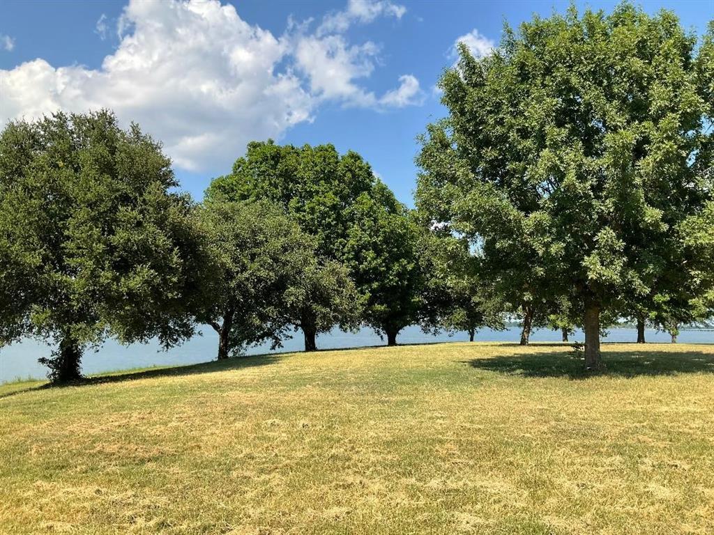 An amazing property just waiting for your plans!  Building options limited only by your imagination! Two plus acres of gently sloping lakefront. Over 800 feet of open shoreline with retaining wall in place!  No HOA. This is your private oasis with plenty of space to design and build your custom dreams! Public boat ramp just yards away. Owner will Finance!