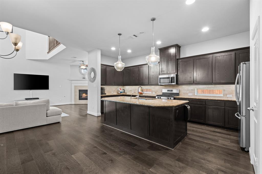 Welcome to a home where comfort, style, and everyday functionality come together beautifully. This thoughtfully designed residence offers 3 bedrooms, 2.5 bathrooms, two spacious living areas, a dedicated dining space, and a warm fireplace that creates the perfect centerpiece for relaxing evenings and memorable gatherings.

From the moment you step inside, you’ll appreciate the soaring ceilings and open-concept layout that fill the home with natural light and create an inviting sense of space. The gourmet kitchen is designed for both convenience and connection, flowing effortlessly into the main living areas so you can cook, entertain, and spend time with family and friends all at once.

A private study adds flexibility to the home and is ideal for a home office, reading room, or quiet personal retreat. The oversized family room offers the perfect place to unwind, entertain guests, or simply enjoy cozy nights by the fireplace.

Located in North Arlington’s only master-planned community, this home offers access to a resort-style lifestyle with outstanding amenities, beautifully maintained surroundings, and close proximity to shopping, dining, and entertainment.

Combining elegance, comfort, and an unbeatable location, this is an exceptional opportunity to own a beautifully maintained home in one of Arlington’s most desirable communities.