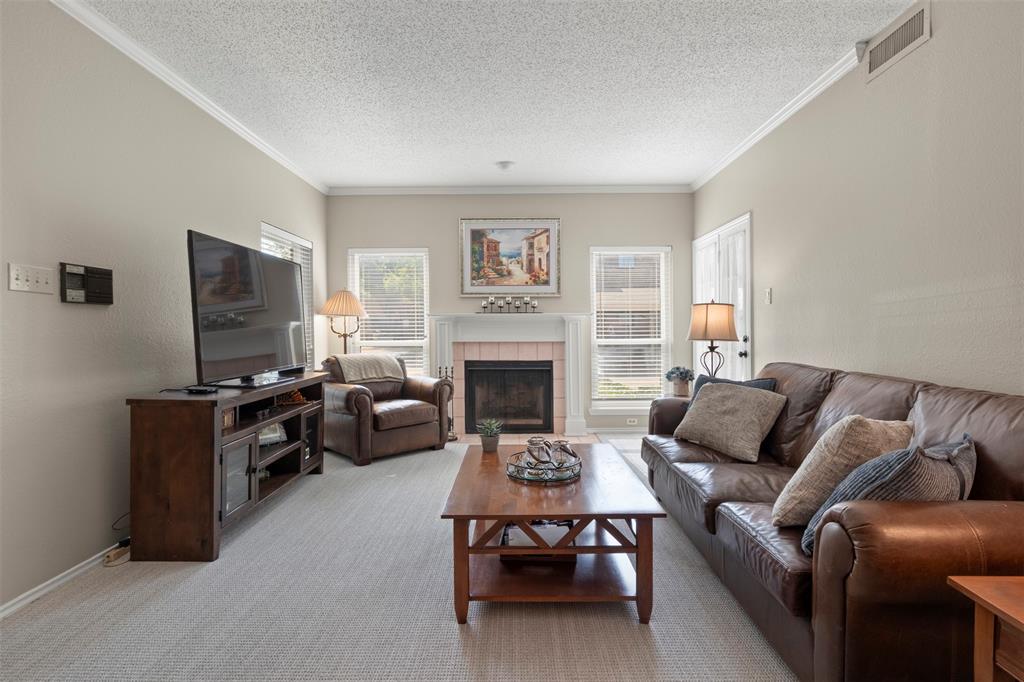 Welcome to this beautifully maintained first-floor condo in the desirable gated Cobblestone Square community, ideally located in the heart of North Dallas. Offering 2 bedrooms, 2 full bathrooms, and an inviting open-concept layout, this home is filled with natural light from an abundance of windows, creating a warm and welcoming atmosphere throughout.
The spacious living area features a cozy fireplace and flows seamlessly into the dining area and kitchen, making it perfect for both everyday living and entertaining. The kitchen offers ample cabinetry, a breakfast bar, built-in storage, and a charming garden window that's ideal for herbs or indoor plants. The private primary suite includes a walk-in closet, dual vanities, and a separate shower, while the secondary bedroom and full bath provide comfort and flexibility for guests or a home office.
Enjoy relaxing on your private covered patio, just steps from the community pool and mailbox. Additional highlights include assigned covered parking, Energy Star features, and a prime location with easy access to Preston Road, the President George Bush Turnpike, the Dallas North Tollway, shopping, dining, and entertainment. Located within highly regarded Plano ISD, this move-in-ready condo offers the perfect blend of comfort, convenience, and low-maintenance living.