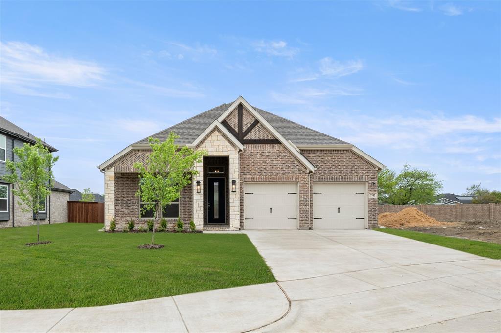 MLS# 20794275 - Built by First Texas Homes - Ready Now! ~ Step into this exquisite 4-bedroom, 3-bath home boasting a bright, open-concept layout. Soaring ceilings, expansive slider doors, and a spacious covered patio create a seamless indoor-outdoor flow. The upgraded stone elevation with a charming front porch adds timeless curb appeal to this standout property.