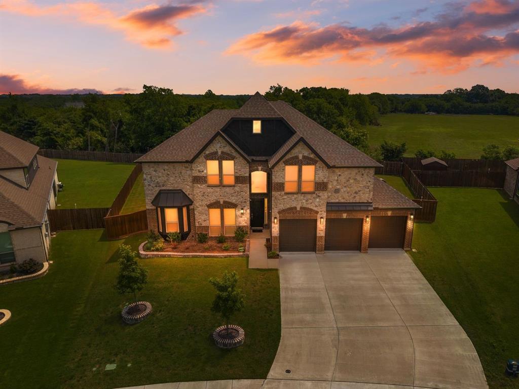 Welcome to this spectacular, brand-new construction masterpiece situated on a premium, oversized lot backing up to a serene, private greenbelt. Designed with unparalleled luxury and thoughtful upgrades, this impressive home features 5 spacious bedrooms—including two show-stopping primary suites—plus a dedicated home office. The open-concept living area and custom theater room come fully equipped with built-in surround sound, while extra recessed lighting throughout the home and elegant under-cabinet lighting in the kitchen create a bright, inviting ambiance. Every detail has been elevated, from the convenience of a central vacuum system to the massive, oversized 3-car garage. Step outside to your expansive, oversized covered patio to enjoy peaceful nature views, or take advantage of the fantastic neighborhood amenities just moments away, including parks and pickleball courts. This turn-key luxury estate truly has it all!