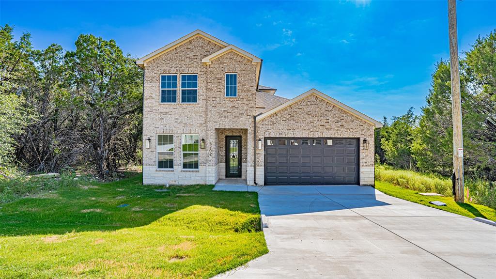 Step into sophistication in this beautifully crafted two-story residence, where thoughtful design meets everyday comfort. Offering over 2,200 square feet of interior space, this 4-bedroom, 3-bathroom home includes a spacious 2-car garage and countless upgrades throughout. From the moment you enter through the grand 8-foot wrought iron doors, you're greeted by soaring ceilings and an airy layout. The main living area impresses with its dramatic 20-foot ceilings and abundant natural light, creating an inviting space for relaxing or entertaining.Centrally located, the gourmet kitchen is a true centerpiece—equipped with custom cabinets, a generous center island, and upscale finishes that elevate every meal. The luxurious downstairs primary suite offers a tranquil escape, complete with a spa-inspired bath and a sizable walk-in closet. Upstairs, two additional bedrooms each include a private study nook, offering the perfect blend of privacy and productivity for remote work or homework time. Additional features include a dedicated mudroom, well-appointed laundry area with built-in sink, full home spray foam insulation, a complete sprinkler system, and a fully fenced backyard with cedar privacy fencing. Built with durability, energy efficiency, and modern living in mind—this home is ready to impress. Don’t miss the opportunity to see it for yourself!