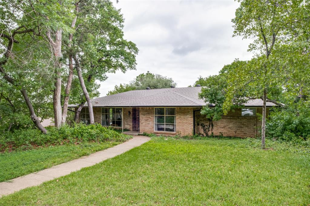 Perfectly positioned in one of Dallas’s most sought-after neighborhoods this prime property has a backyard with views of the Stevens Park Golf course.  This one owner custom home offers an opportunity for upgrades in a coveted location in Kessler Park. The Retro kitchen has builtin Sub Zero refrigerator and Bosch built-in oven. All electric smooth cooktop. True to it's 70's style, there are formal living and dining areas as well as a separate den with original brick flooring and a raised hearth fireplace. Recent updates include  roof, sliding glass door in the den and updated HVAC in 2025. There is a separate laundry area and a guest bath off the kitchen.  There is also a bonus room over the garage not included in the measured square footage. The home is located on a beautiful treed lot in a culdesac. Walk to the Stevens Park Golf Course and grab a burger at the Stevens Park clubhouse. The Coombs Creek walking trail is located about a half mile from the house. In this location you have the option of dining or shopping at Sylvan 30, Trinity Grove or the bustling Bishop Arts areas.