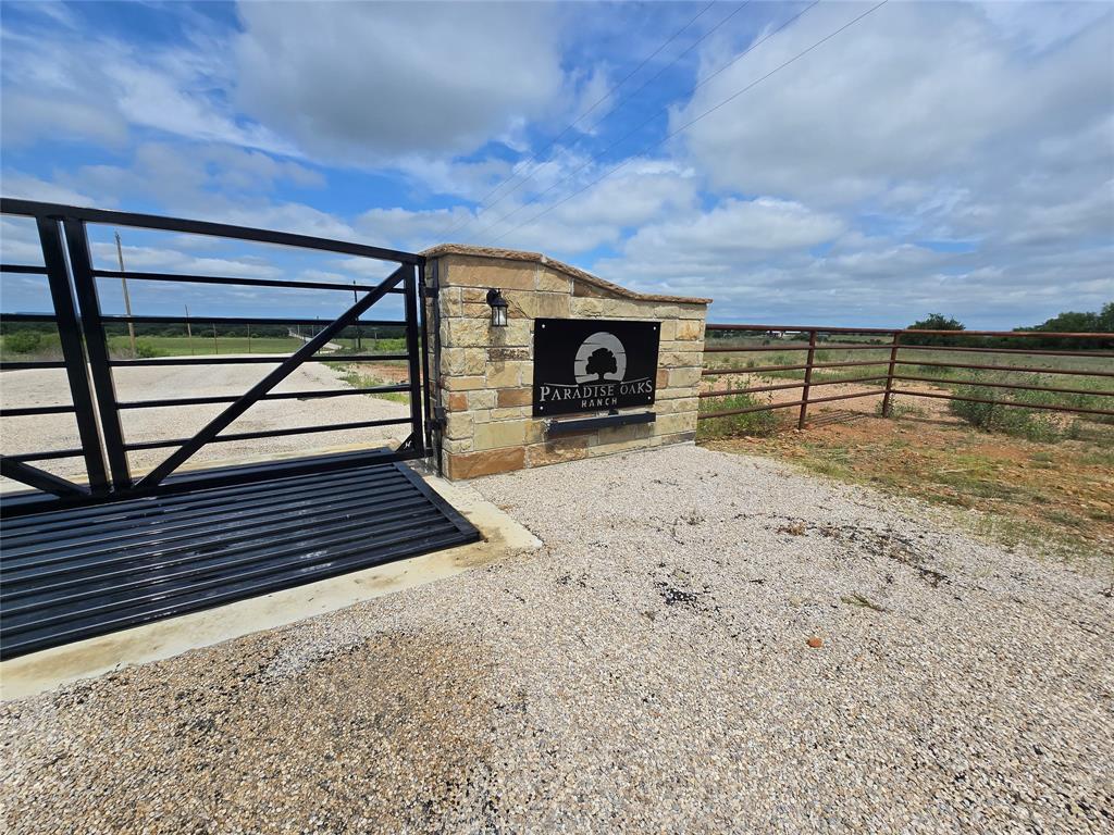 Imagine waking up to the soft glow of the Texas sunrise over your very own 5-acre canvas in Perrin, Texas. Here, in this gated ranch community, the possibilities are endless—you could build a spacious barndominium, a cozy cabin, or your ultimate weekend retreat, all while enjoying the freedom of minimal HOA restrictions.

Spend your mornings sipping coffee on your porch as cattle graze nearby, knowing the cattle share helps maintain the agricultural tax exemption while you truly own your land. Out your window, wide-open skies stretch for miles, and at night, the stars shine bright and clear, reminding you that you’re living deep in the heart of Texas.

Adventure is never far away. Just a short drive takes you to Possum Kingdom Lake, perfect for boating, fishing, or a weekend escape. Explore Weatherford or Mineral Wells for dining, shopping, and local events. And for bigger city attractions, Fort Worth and the Will Rogers Memorial Center are only 90 minutes away—offering rodeos, shows, and all the culture of a bustling city, while you return home to peace and privacy.

Whether you dream of a barndominium with high ceilings and open living spaces, a ranch-style retreat, or a weekend getaway to recharge from the city, this property is your opportunity to live the Texas country lifestyle you’ve always imagined. Build your dream, enjoy the land, and make memories in a place where freedom, nature, and community come together.
